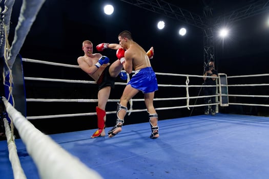 Kickboxing rivals unleash powerful leg strikes in a thrilling match. photo