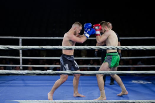 Fierce boxing match showcases athletes' power and skill. photo