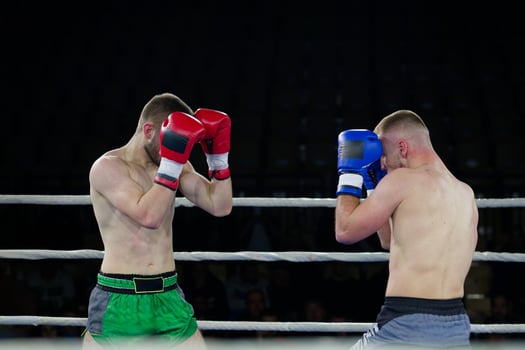 Fierce boxing match showcases athletes' power and skill. photo
