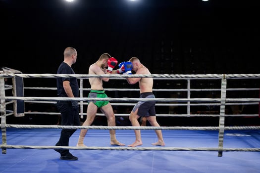 Fierce boxing match showcases athletes' power and skill. photo