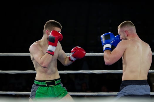Fierce boxing match showcases athletes' power and skill. photo