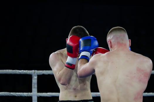Fierce boxing match showcases athletes' power and skill. photo