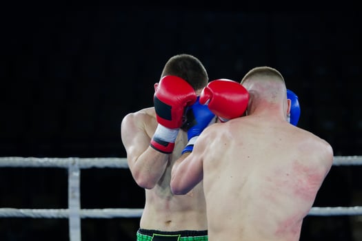 Fierce boxing match showcases athletes' power and skill. photo