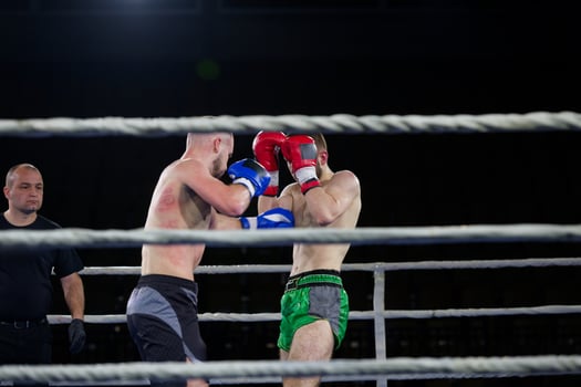 Fierce boxing match showcases athletes' power and skill. photo