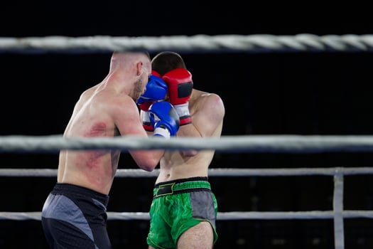 Fierce boxing match showcases athletes' power and skill. photo