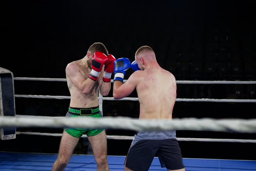 Fierce boxing match showcases athletes' power and skill. photo