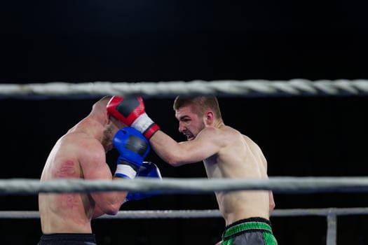 Fierce boxing match showcases athletes' power and skill. photo