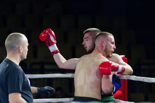Fierce boxing match showcases athletes' power and skill. photo