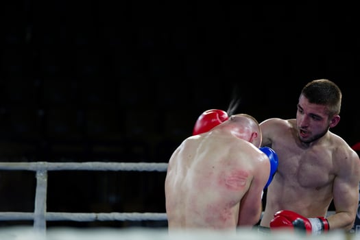Fierce boxing match showcases athletes' power and skill. photo