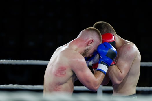 Fierce boxing match showcases athletes' power and skill. photo