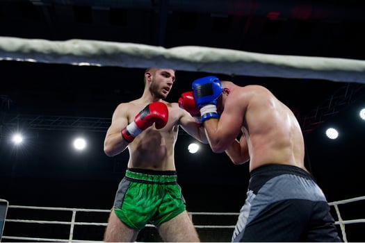 Fierce boxing match showcases athletes' power and skill. photo