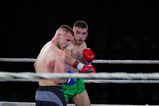 Fierce boxing match showcases athletes' power and skill. photo