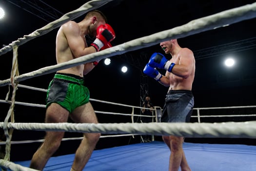 Fierce boxing match showcases athletes' power and skill. photo