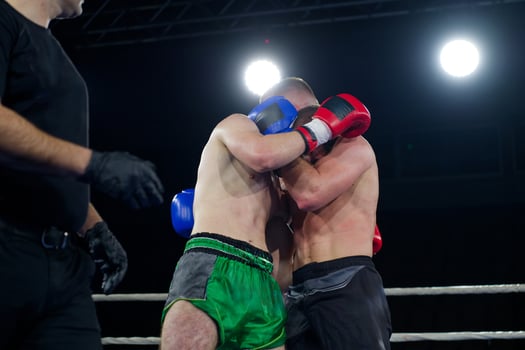 Fierce boxing match showcases athletes' power and skill. photo
