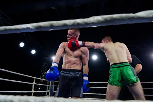 Fierce boxing match showcases athletes' power and skill. photo