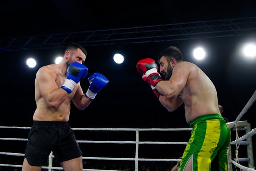 Fierce boxing match showcases athletes' power and skill. photo