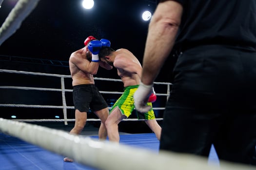 Fierce boxing match showcases athletes' power and skill. photo