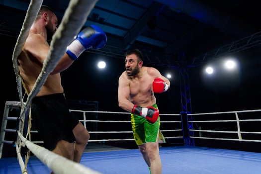 Fierce boxing match showcases athletes' power and skill. photo