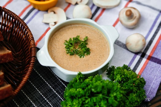 Creamy Mushroom Soup With Parsley Garnish photo