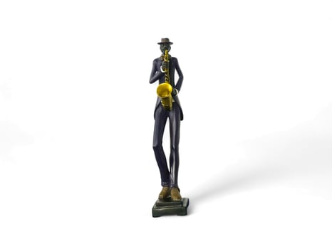 Ornamental miniature of a person playing a trumpet musical instrument on a white background photo