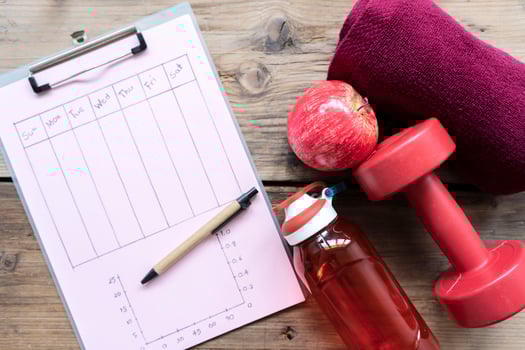 Personal workout plan with sneakers, smartphone and other fitness stuff. photo
