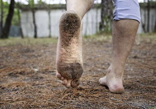 Dirty feet with mud photo
