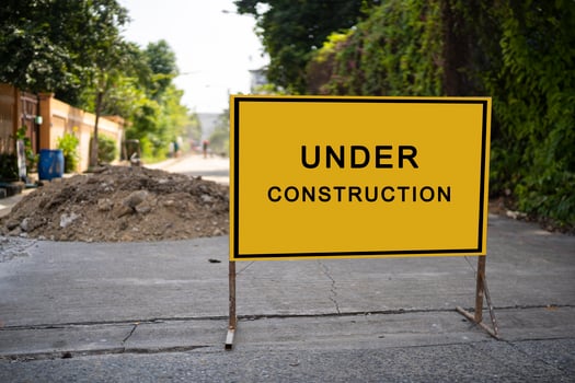 building structure with message under construction. photo