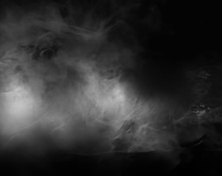 Minimalist Wooden Table with Atmospheric Smoke and Dark Background photo
