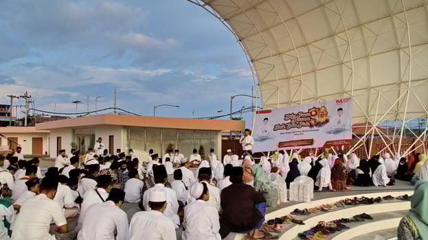 Muslim citizens gathering together to pray together photo