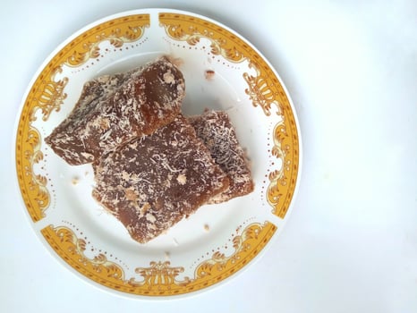 Ongol Ongol, Indonesian Traditional Snacks, made from Arrowroot Flour and Brown Sugar, on white background photo