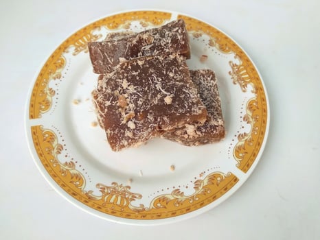 Ongol Ongol, Indonesian Traditional Snacks, made from Arrowroot Flour and Brown Sugar, on white background photo