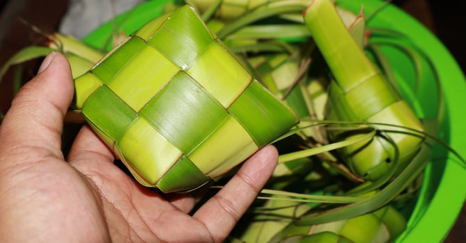 Ketupat is a food made from rice which is wrapped in woven young coconut leaves photo