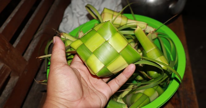 Ketupat is a food made from rice which is wrapped in woven young coconut leaves photo