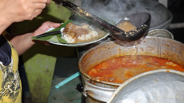 Gandul Rice is a local Indonesian food famous for its various side dishes of beef offal photo