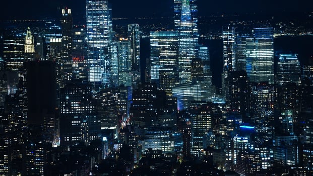 The New York city night view with the lights on in the skyscrapers at night photo