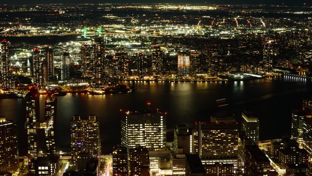 The New York city night view with the lights on in the skyscrapers at night photo