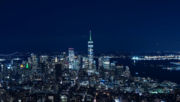 The New York city night view with the lights on in the skyscrapers at night photo