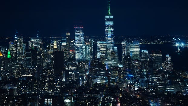 The New York city night view with the lights on in the skyscrapers at night photo