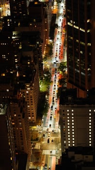 The New York city night view with the lights on in the skyscrapers at night photo