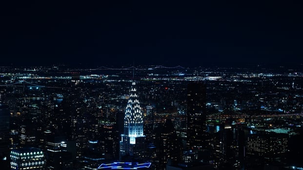 The New York city night view with the lights on in the skyscrapers at night photo