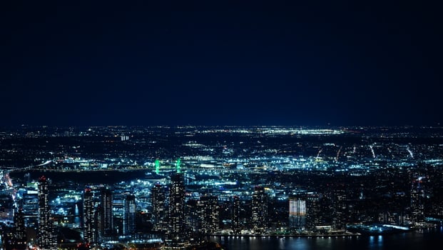 The New York city night view with the lights on in the skyscrapers at night photo