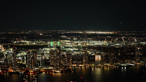 The New York city night view with the lights on in the skyscrapers at night photo