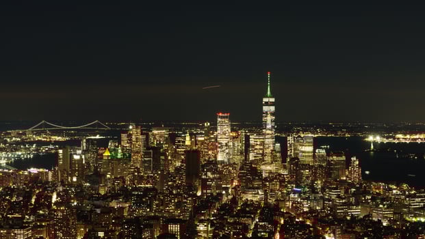 The New York city night view with the lights on in the skyscrapers at night photo