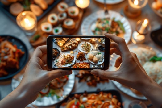 Taking photo of feast with smartphone