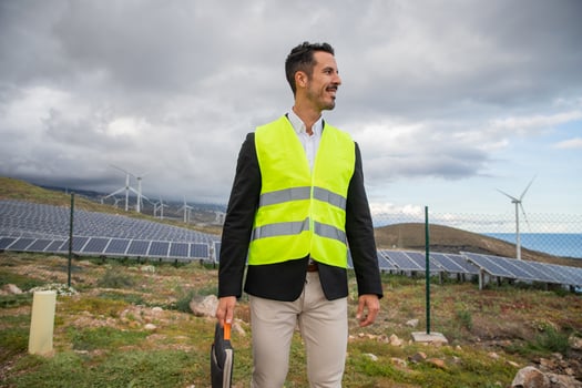 An engineer holds a laptop sleeve during an inspection at the solar power plant photo