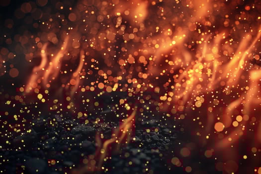 Close up of vibrant orange sparks and embers floating in air with a dark background photo