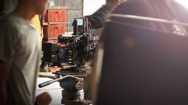 Film director and crew making commercial content advertising in studio. photo