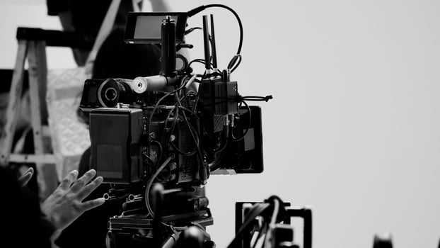 Film director and crew making commercial content advertising in studio. photo