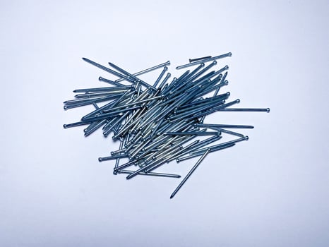 Finishing galvanized nails for high-quality fasteners of such materials as skirting boards, shtapik, parquet, platbands lining photo