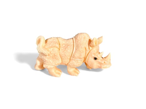 Decorated miniature rhinoceros isolated on white photo